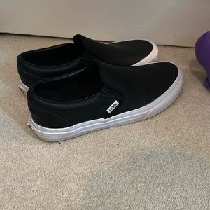 Women’s size 9 leather slip on black vans sneakers